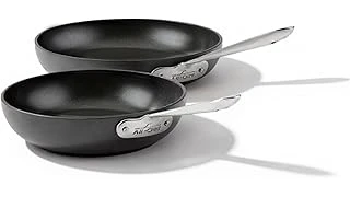 The image shows an array of shiny, induction-compatible cookware, highlighting the best 31 pans.